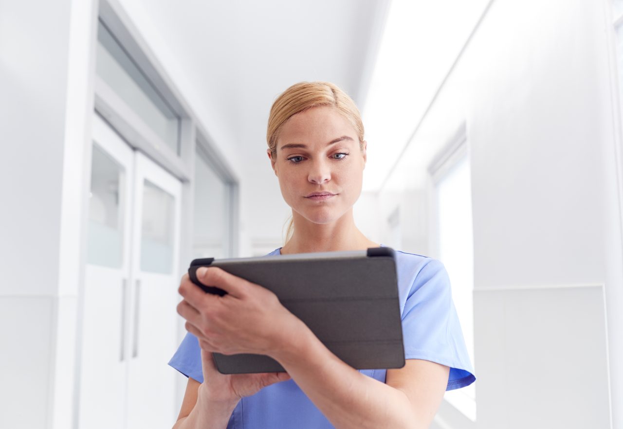 female-doctor-wearing-scrubs-in-hospital-corridor-2021-08-27-12-01-25-utc-1280x882.jpg